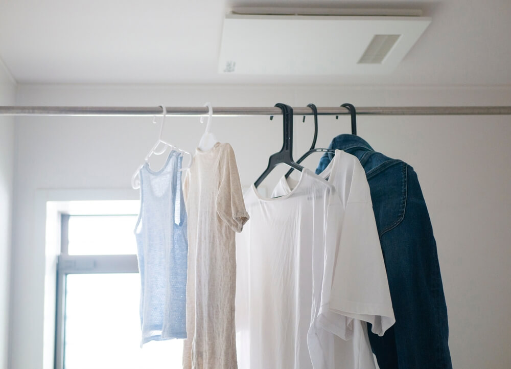 clothes drying inside in curtain rod